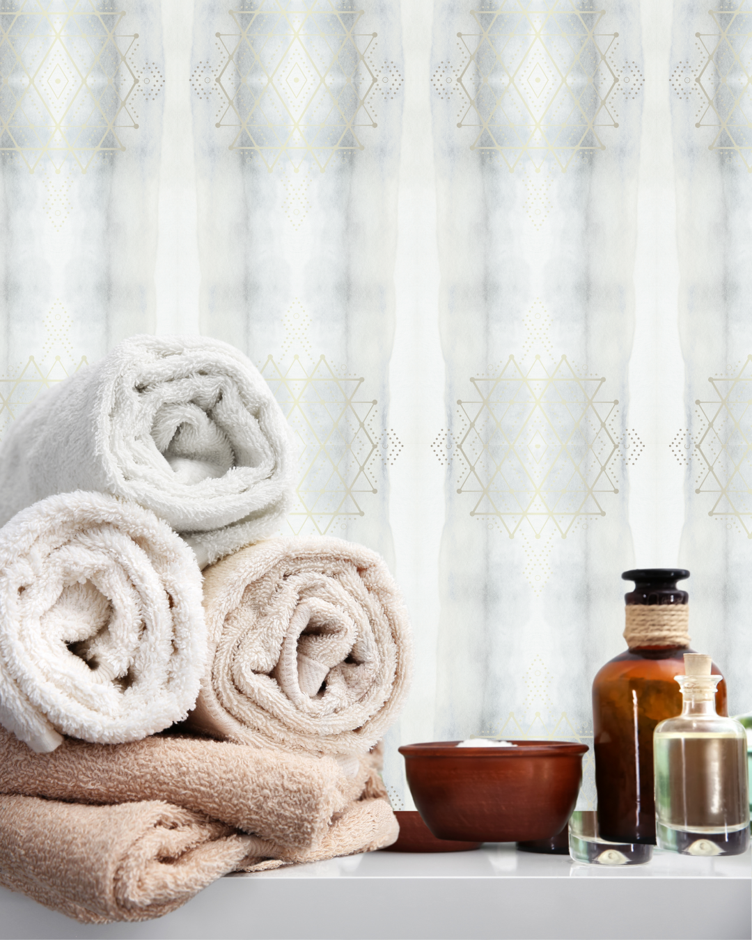 Release Collection removable peel and stick wallpaper in Blue Smoke, shown in a spa room. Encoded with light codes for emotional letting go and renewal by Sacred Interior.
